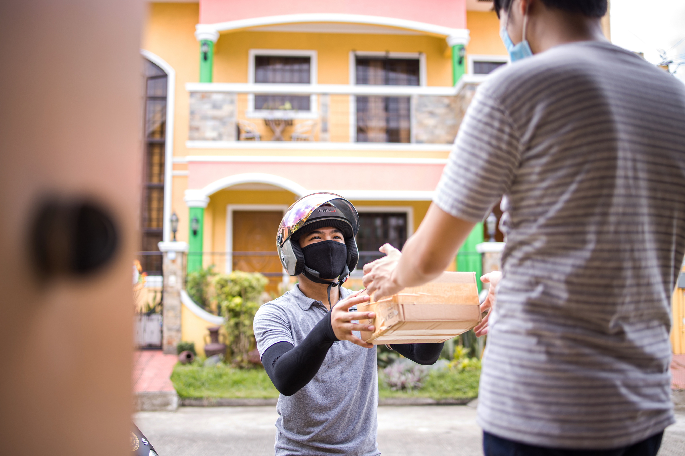 Delivery Man Handing Off Costumer his Package 